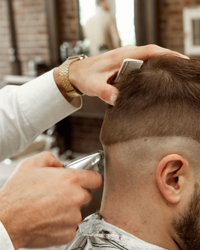 A skin fade blended tight around the ear.