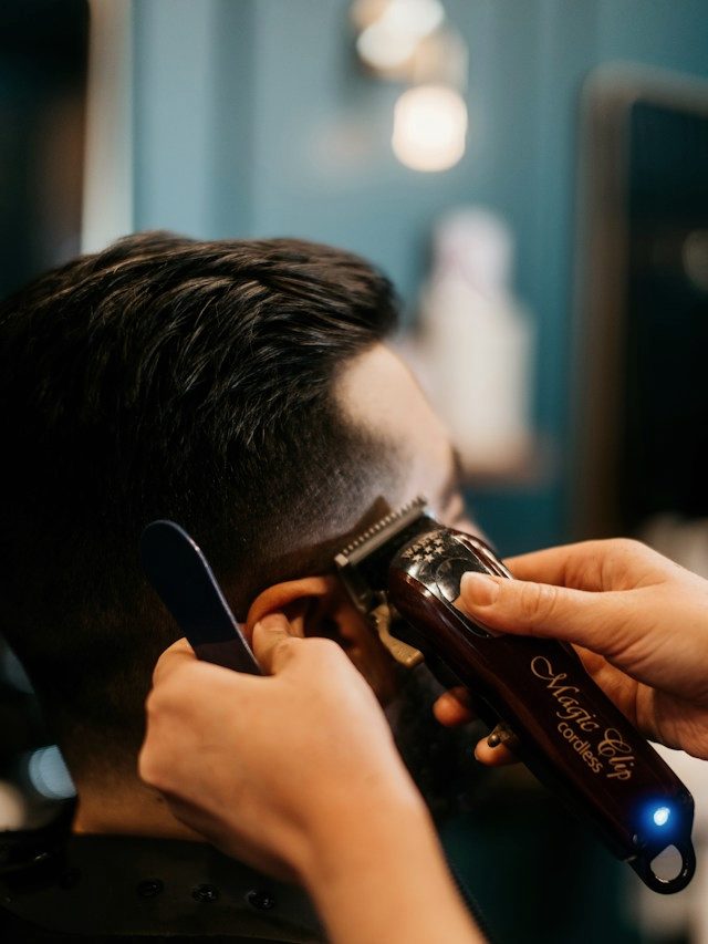 Close detail of a beard line being trimmed with a trimmer.
